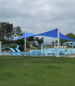 Swimming pool shade structure